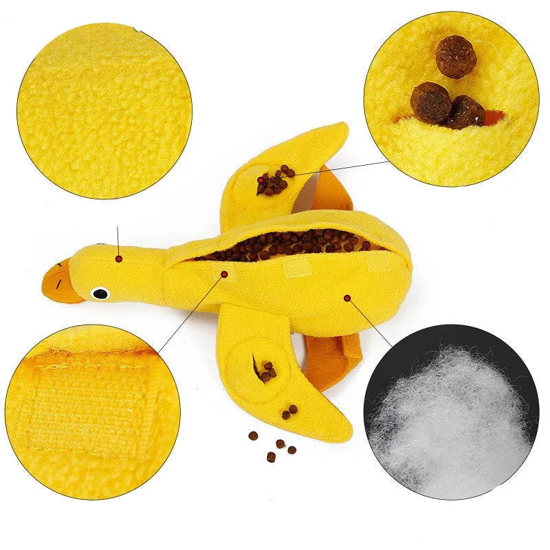 Yellow teddy dog training toy with integrated duck doll and food leak design for scent work
