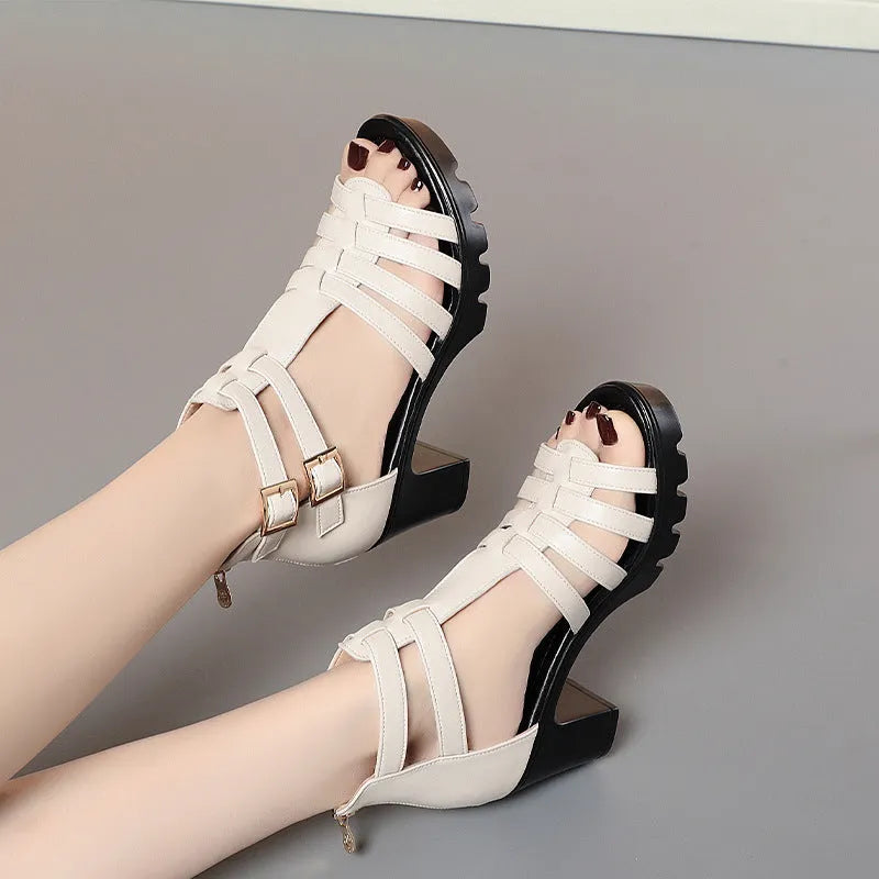 Women's beige high heel shoes with hollow-out design and rhinestone decoration, showing buckle fastener.
