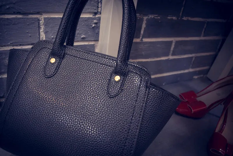 Women's black PU messenger bag with 120cm shoulder strap and zippered inner pocket
