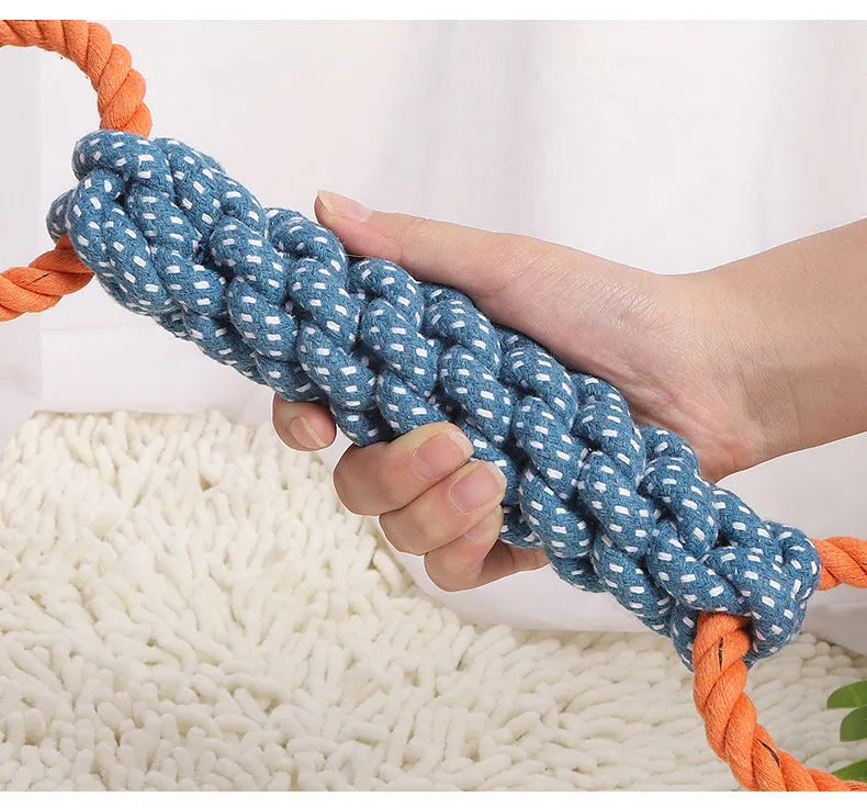 Blue double-ring braided cotton rope dog chew toy showing knot details and size against white background