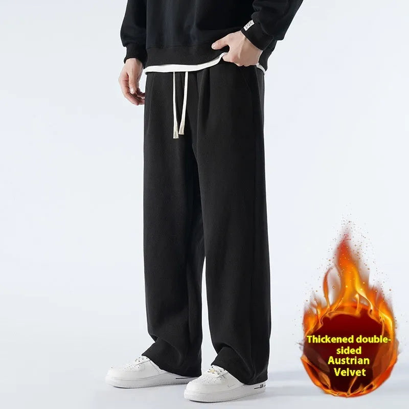 Man wearing apricot coloured loose-fit fleece-lined casual trousers with an elasticated waist.