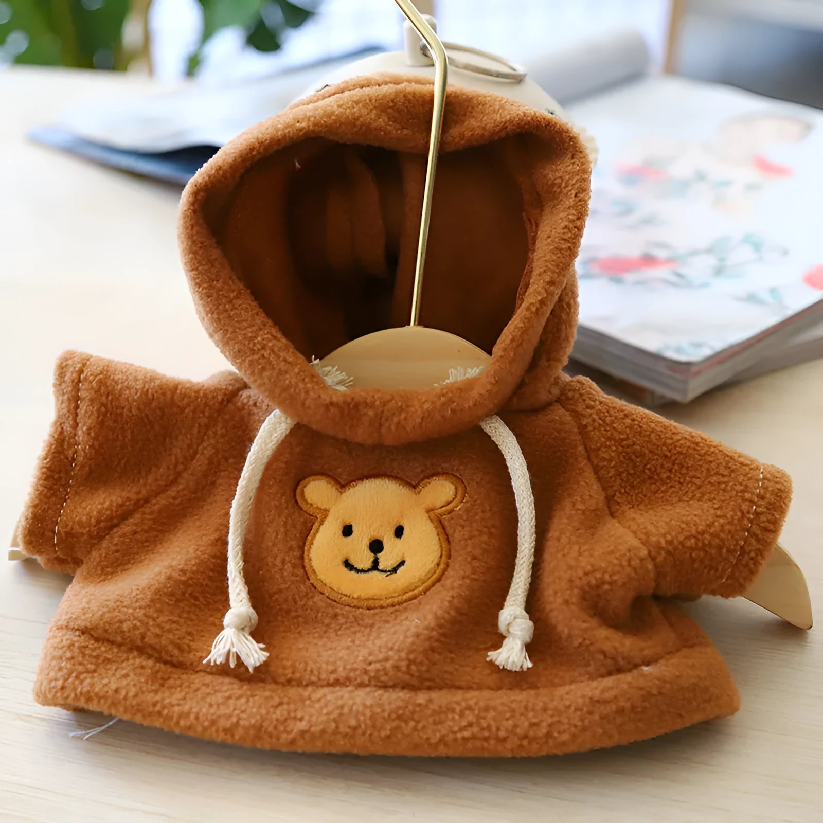 Blue balaclava-style dog hoodie made of soft cloth, shown on a model dog.