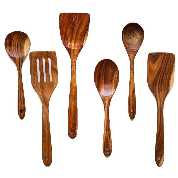 Wooden cooking utensil set with seven different kitchen tools including spoon and shovel