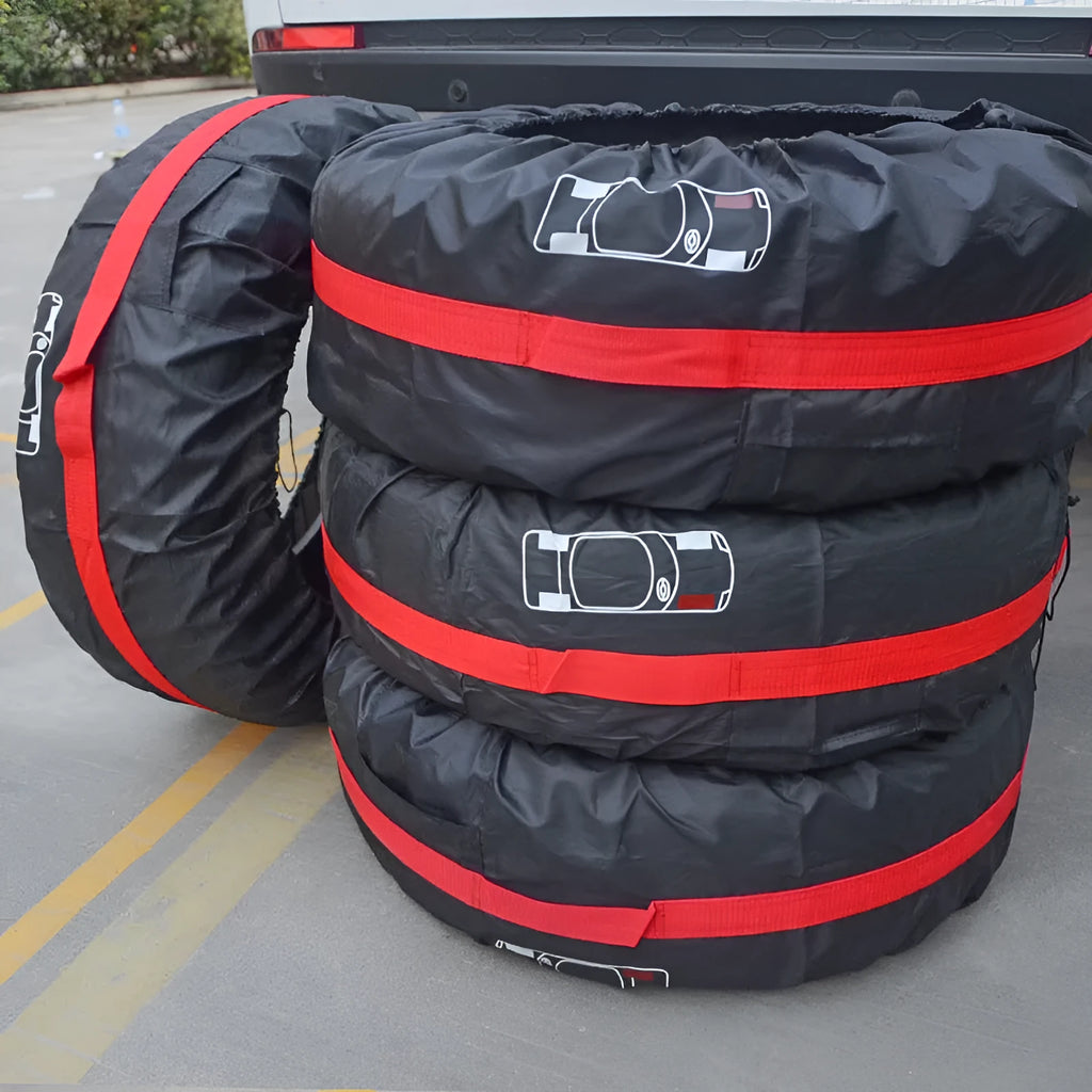 Set of four black Oxford cloth car tyre protective covers for parked vehicles.