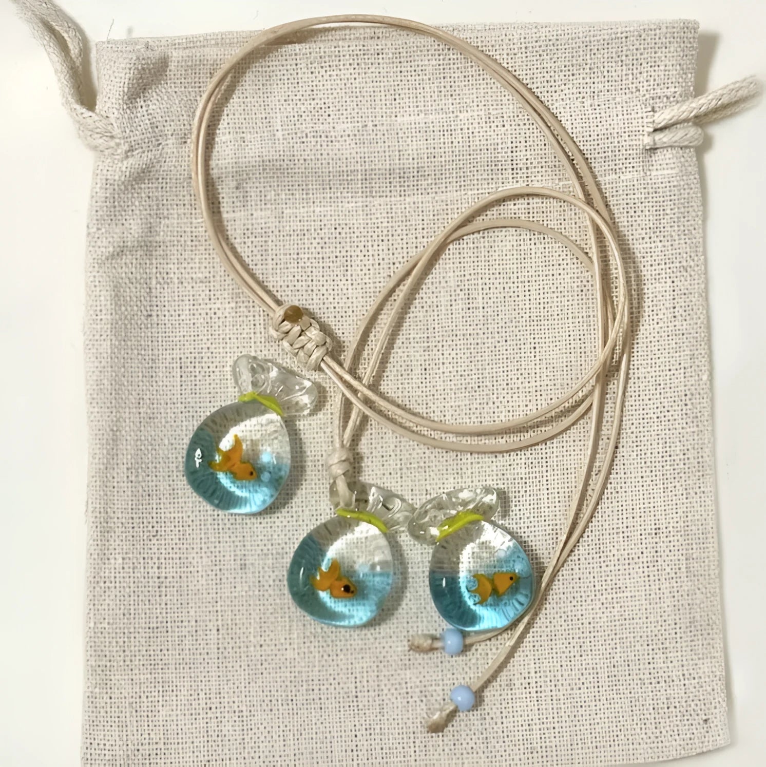 Women's necklace with coloured glaze skirt pendant on cotton linen clavicle chain