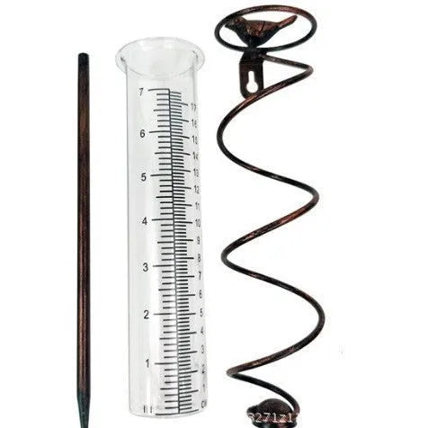 Cast iron bird glass hyetometer rain gauge with hummingbird decoration showing measurement scale