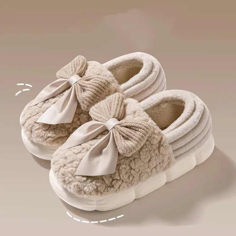 Big bow-knot fluffy slippers with covered heel in pink colour on floor