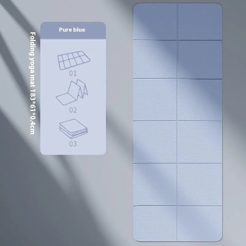 Blue foldable TPE gymnastic mat unfolded on floor showing non-slip texture and dimensions.