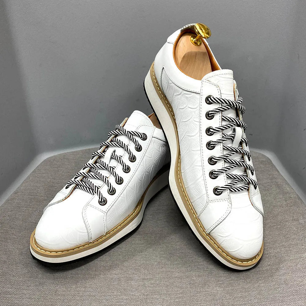 Handmade men's low-cut shoes with an embossed pattern and front-tie lacing.