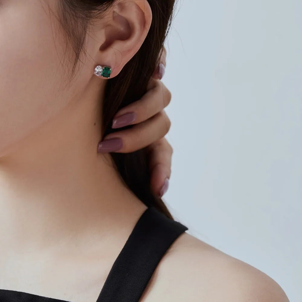Silver stud earrings with emerald green stone in geometric ellipse and quadrilateral shape