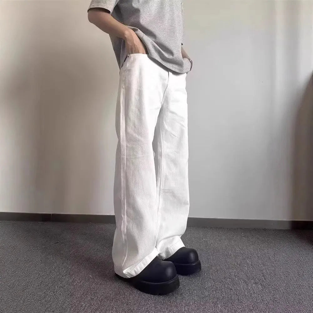 Men's white straight leg jeans with mid-rise waist and zipper fly closure