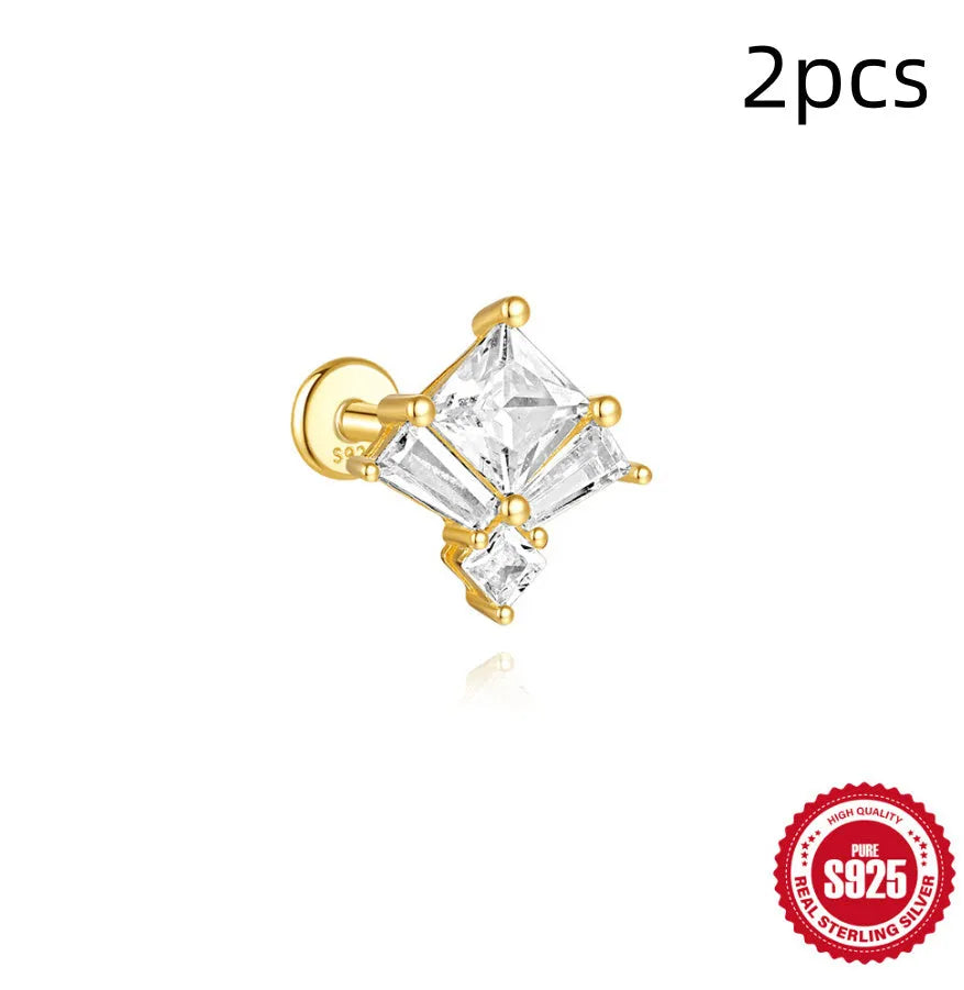 S925 sterling silver stud earring with golden double piercing design and zircon inlaid detail on a white background.