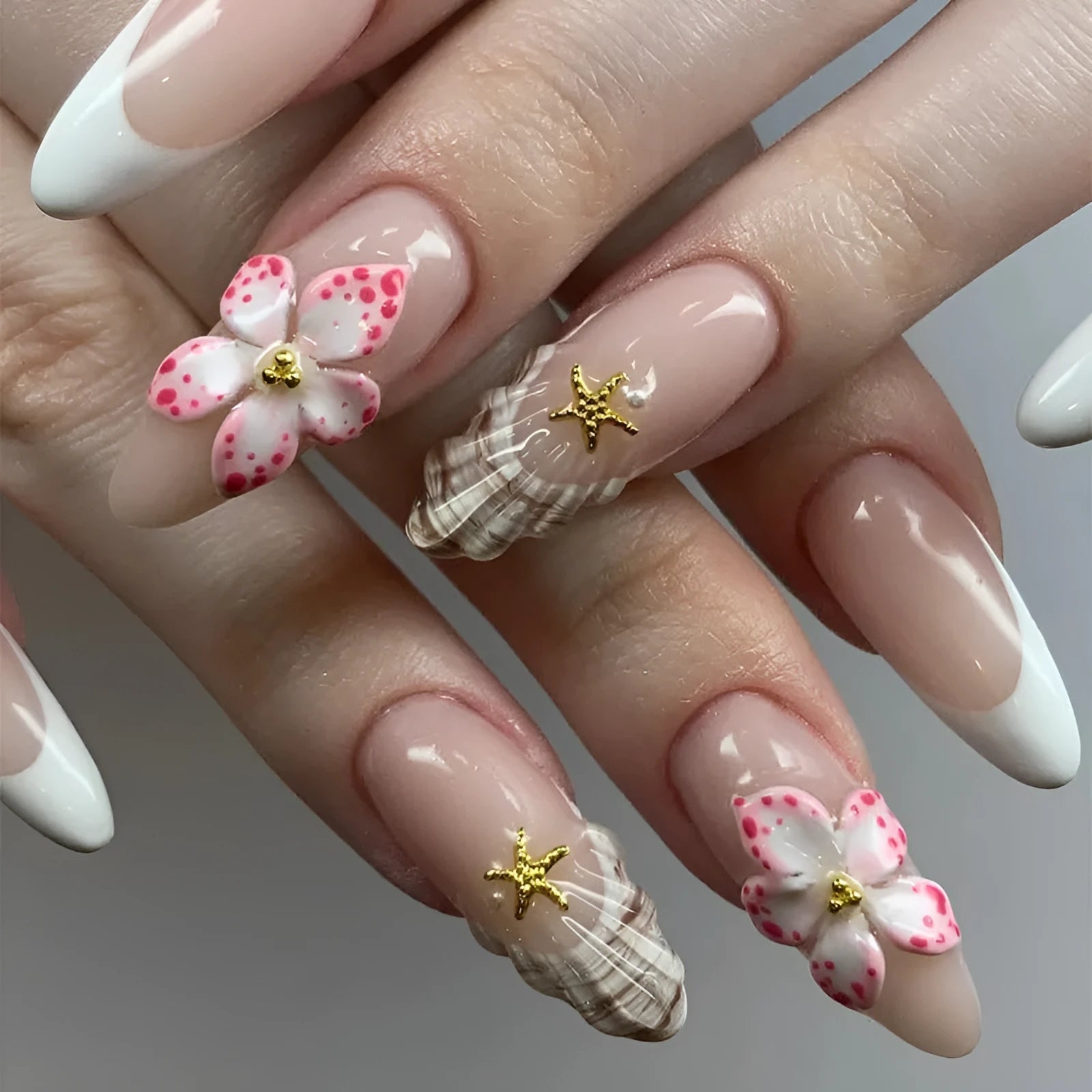 French style fake nails with simple flower pattern in a plastic kit including glue.