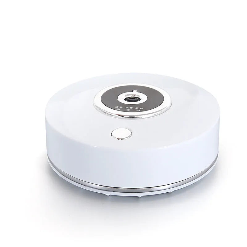 White, grey, and black USB car aromatherapy diffuser with anti-slip pad for dashboard mounting.