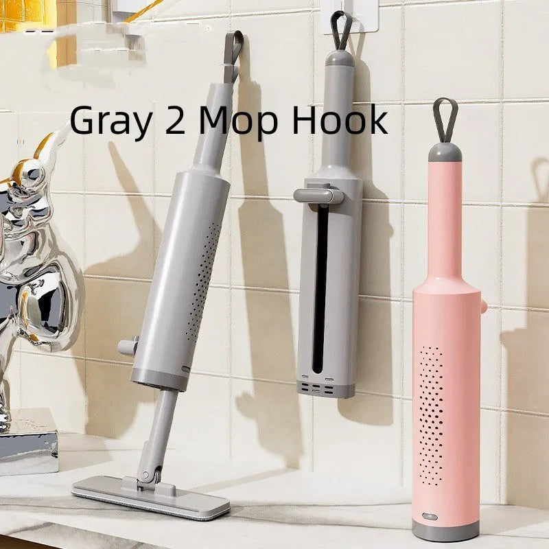 Rotatable self-squeeze mini flat mop with crevice brush and pink microfiber pad, shown extended to 19.3 inches.