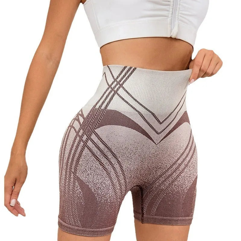 Women's high waisted gradient fitness shorts in black, shown for yoga or dance sport use.