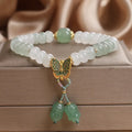 Green Tian Shan Cui abacus bead bracelet with crystal detailing and butterfly tassel