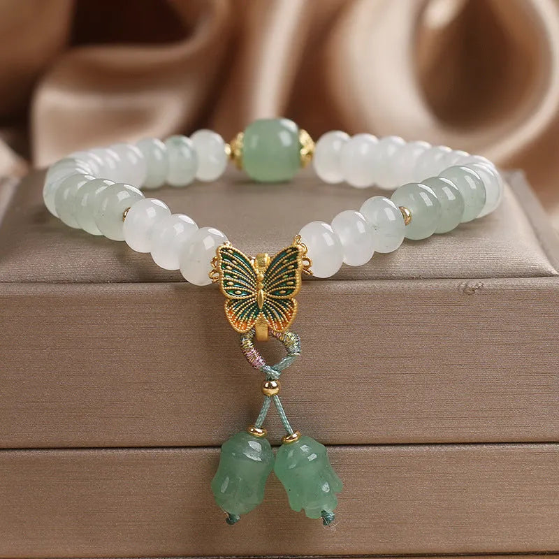 Green Tian Shan Cui abacus bead bracelet with crystal detailing and butterfly tassel