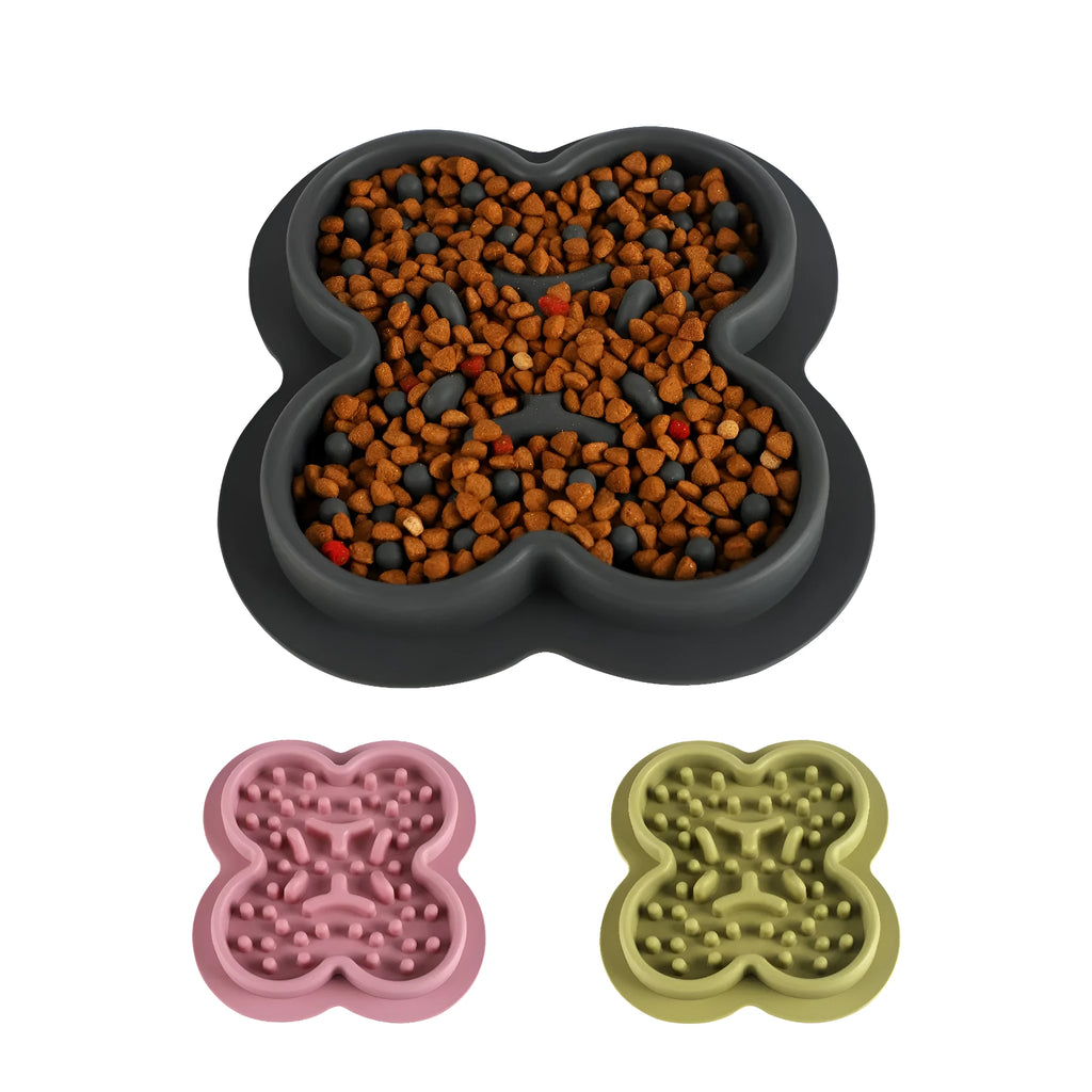Silicone slow feeder licking pad for pets in various colours on a kitchen counter.
