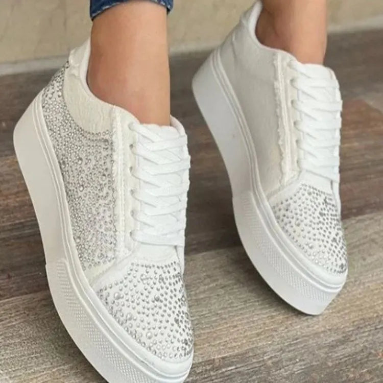 Women's black casual sports shoes with lace-up front, rhinestone detail, and thick rubber sole.