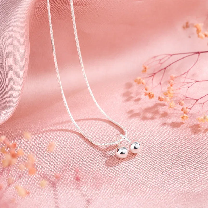 Silver cherry pendant necklace on a snake bone chain, adjustable length, Korean style.