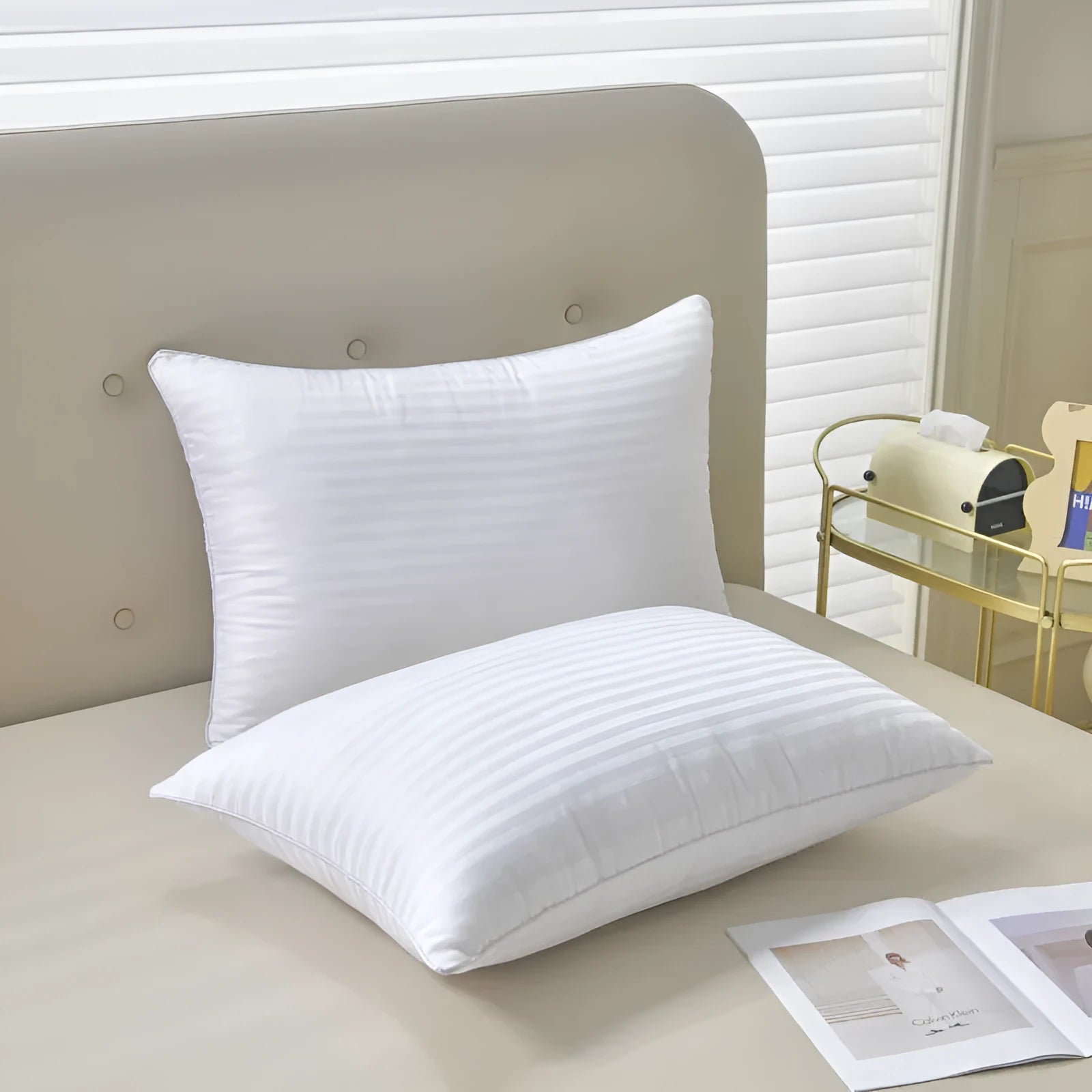 White hotel cotton satin stripe feather and cotton pillow showing size options.