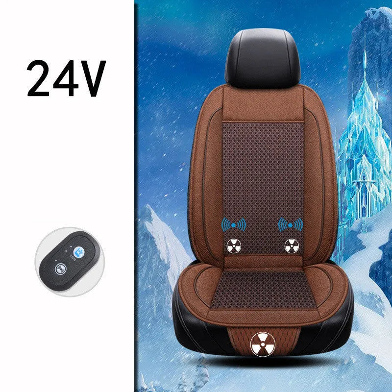 Black car ventilation seat cushion with power cord, shown on a car seat