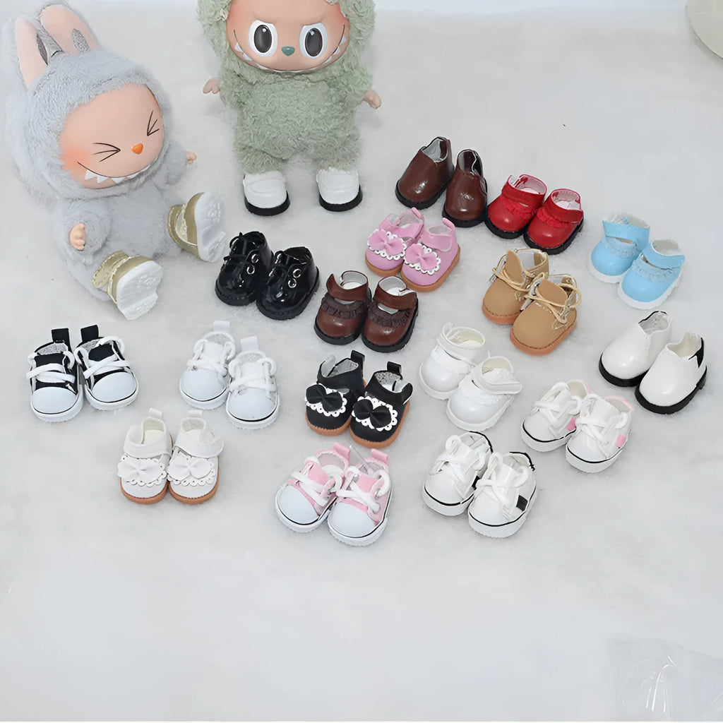 A pair of 17cm scale PU doll shoes in a selected colour and style, such as black leather shoes or brown boots.