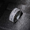 Geometric copper ring with zircon inlay in rose gold finish on neutral background