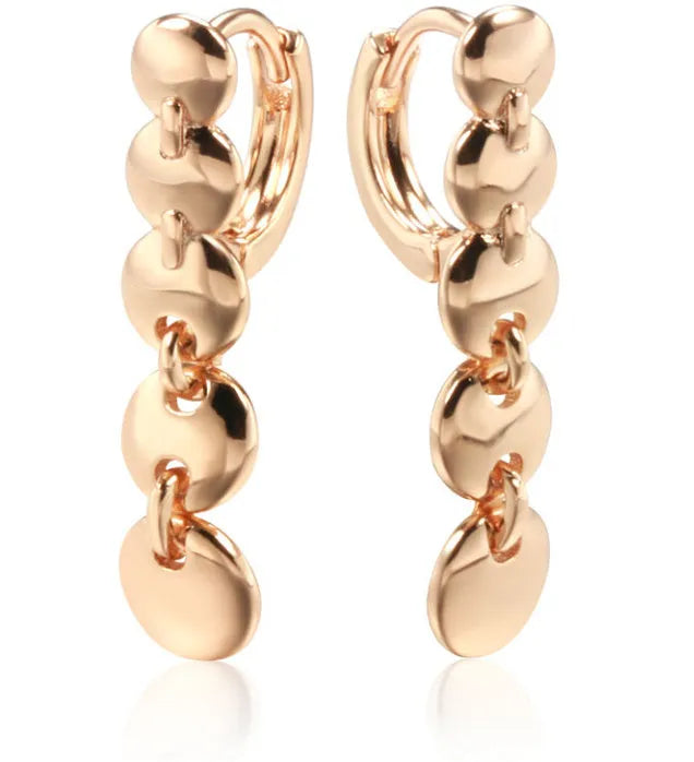 Long round gold retro earrings with woven copper texture, shown as a pair.
