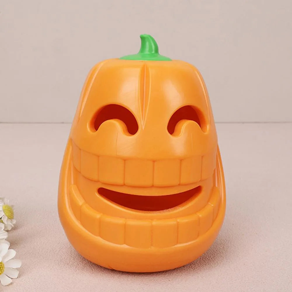 Yellow pumpkin-shaped TPR dog chew toy for aggressive chewers on white background