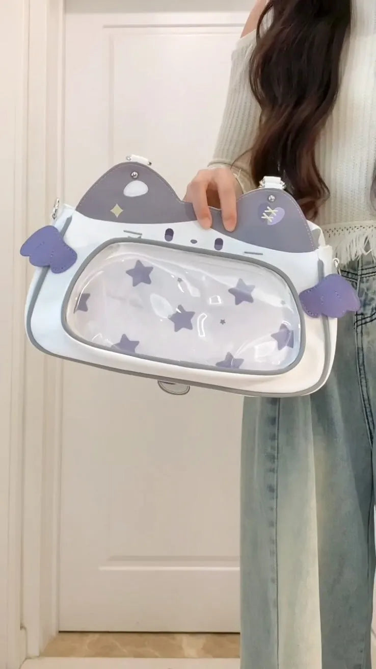 Horizontal cartoon owl pin PU crossbody bag in black, side view showing stitching and single strap