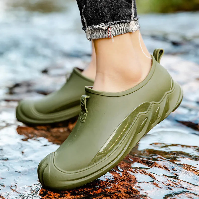 Men's solid colour short rain boots with plastic upper, shown in black, grey, and green.