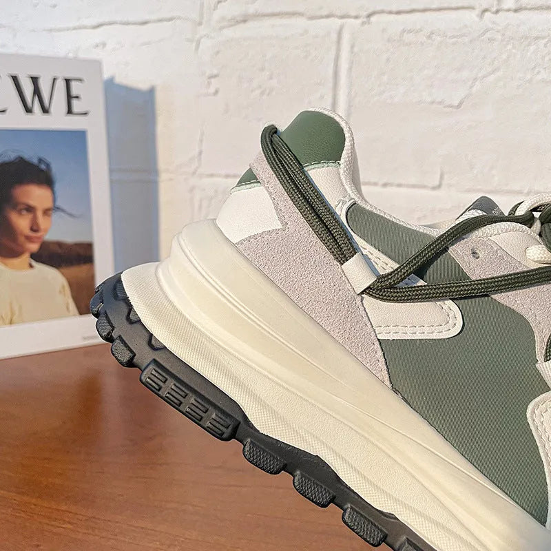 Men's and women's retro platform sneakers in banana green with suede upper, cross strap, and lace-up closure