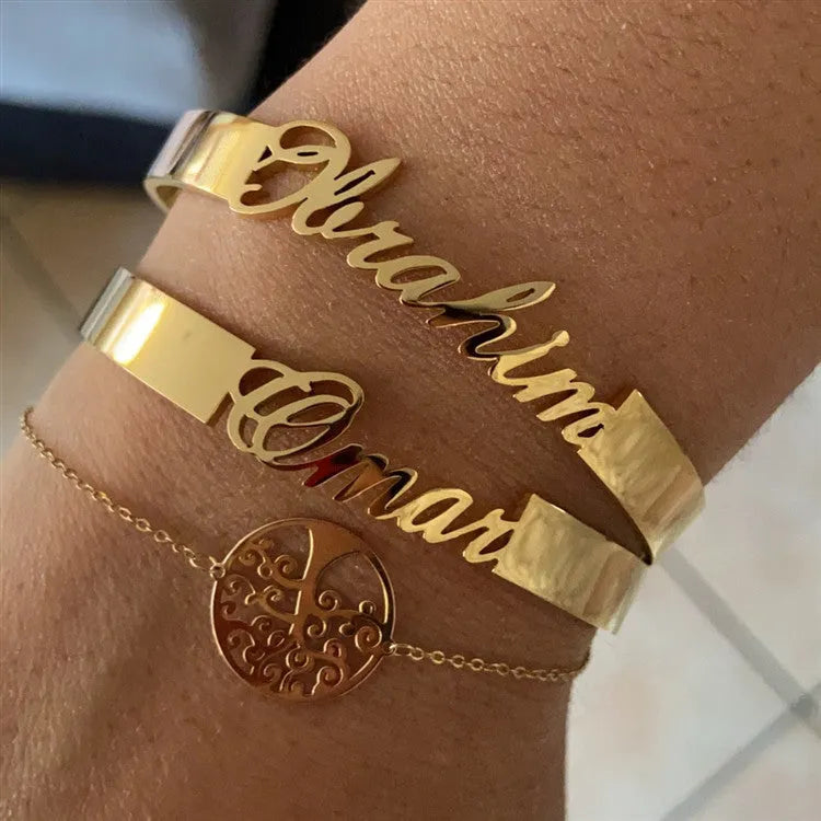 Customised name bracelet in stainless steel with silver finish and 10mm width on display