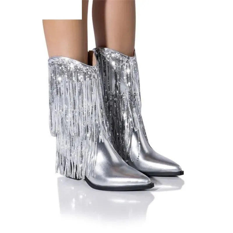Women's black chunky heel ankle boots with tassel detail and super high stiletto heels.
