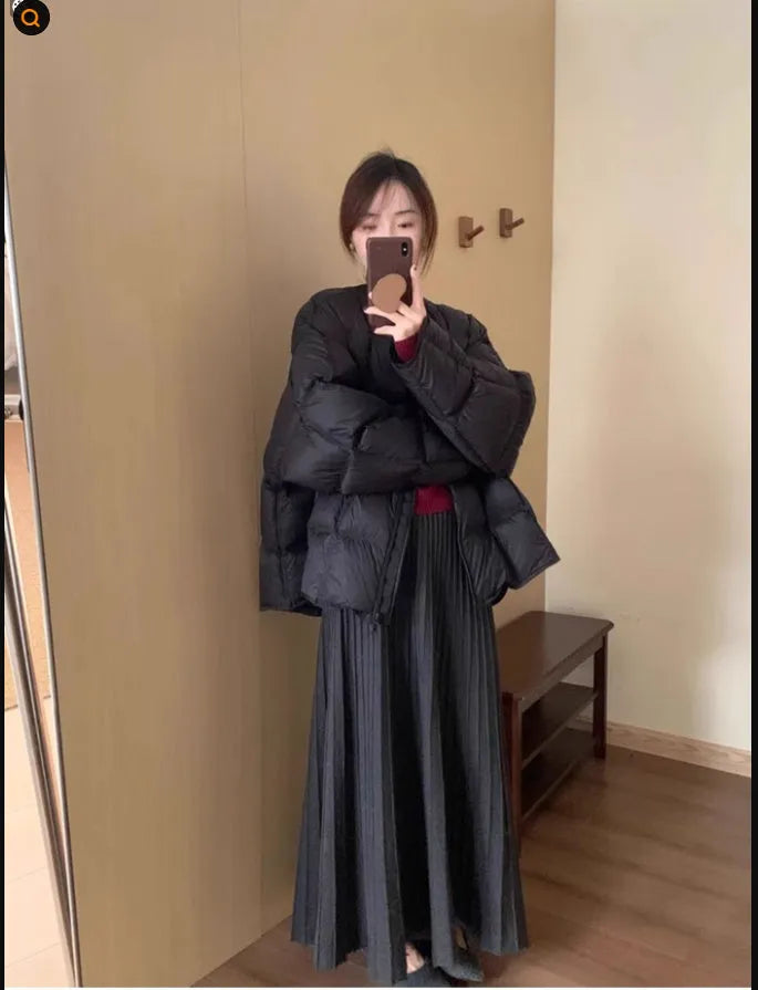 Dark grey knitted two-piece dress suit with 3D pattern, featuring a sweater and skirt in retro ethnic style.