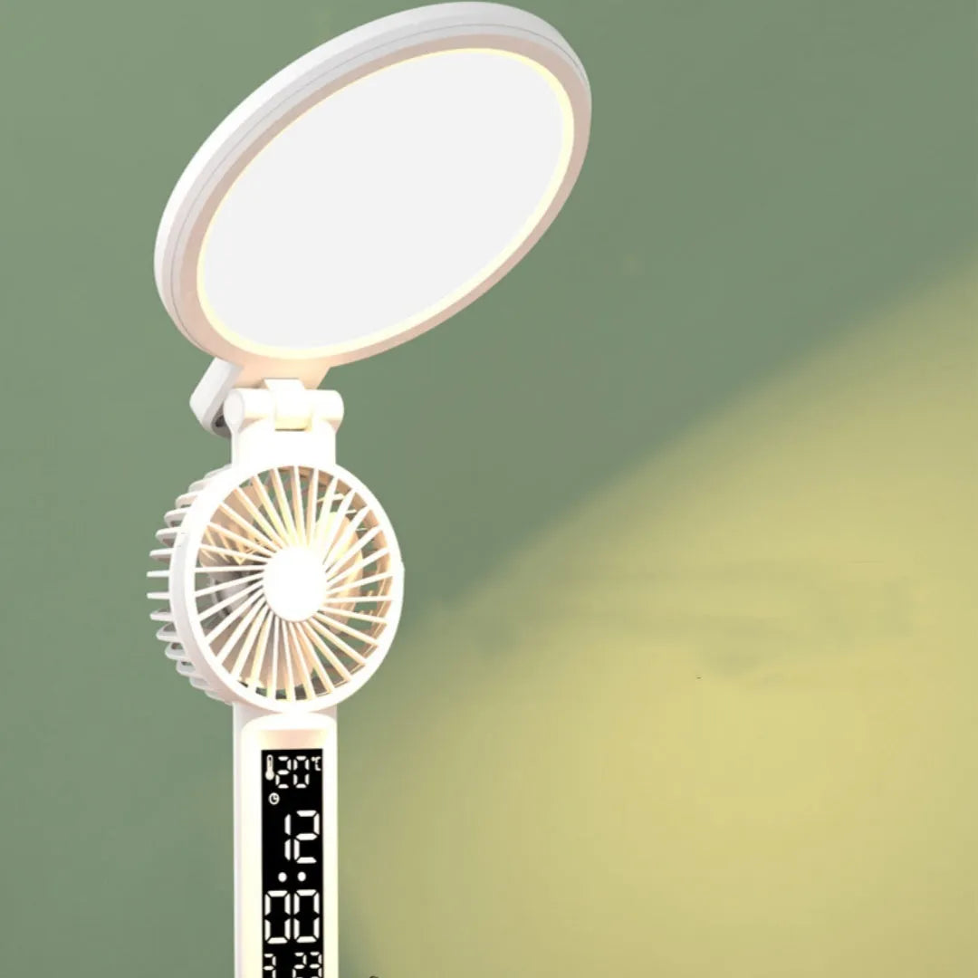 LED clock table lamp with USB rechargeable battery, fan attachment, and digital display on a desk