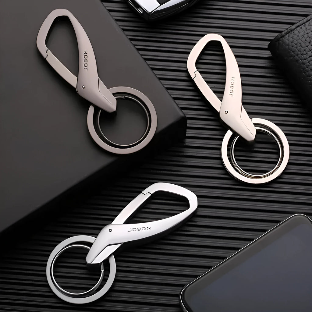 Black zinc alloy double ring car keychain attached to a belt loop.