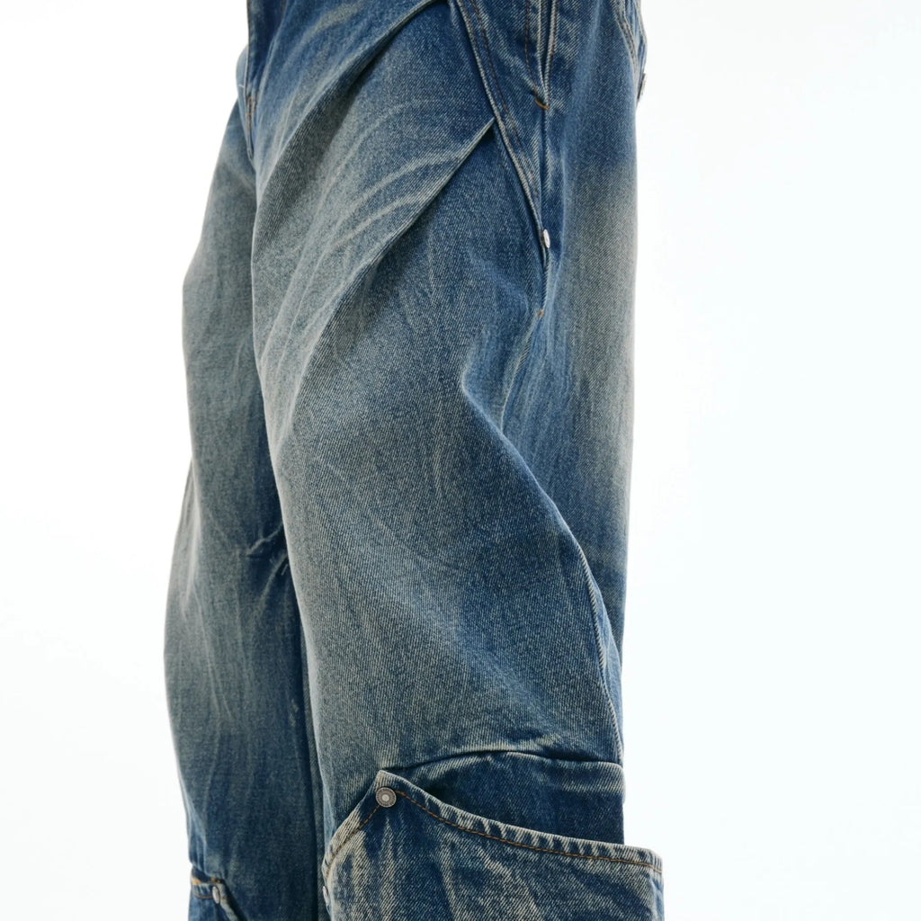 Men's verdant blue jeans with retro washed burst pattern and curved knife silhouette in loose fit