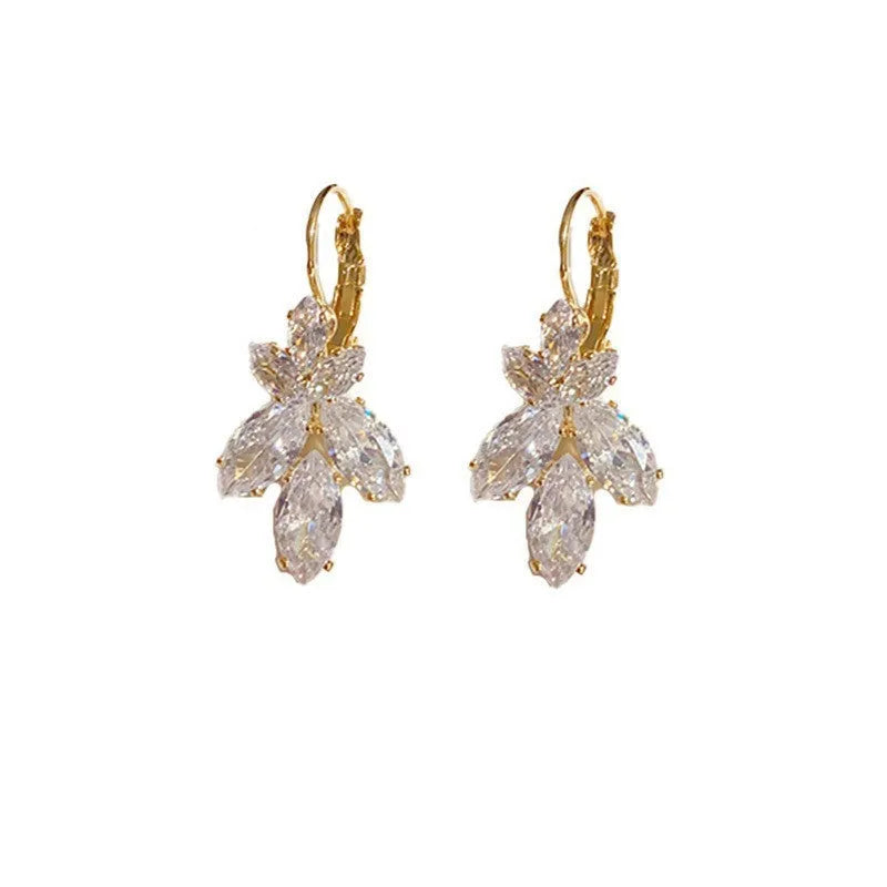Women's platinum alloy earrings with leaves shape and inlaid zircon stones