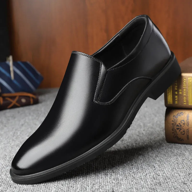 Men's black leather slip-on loafers with a rubber sole and leather toe cap on a white background.