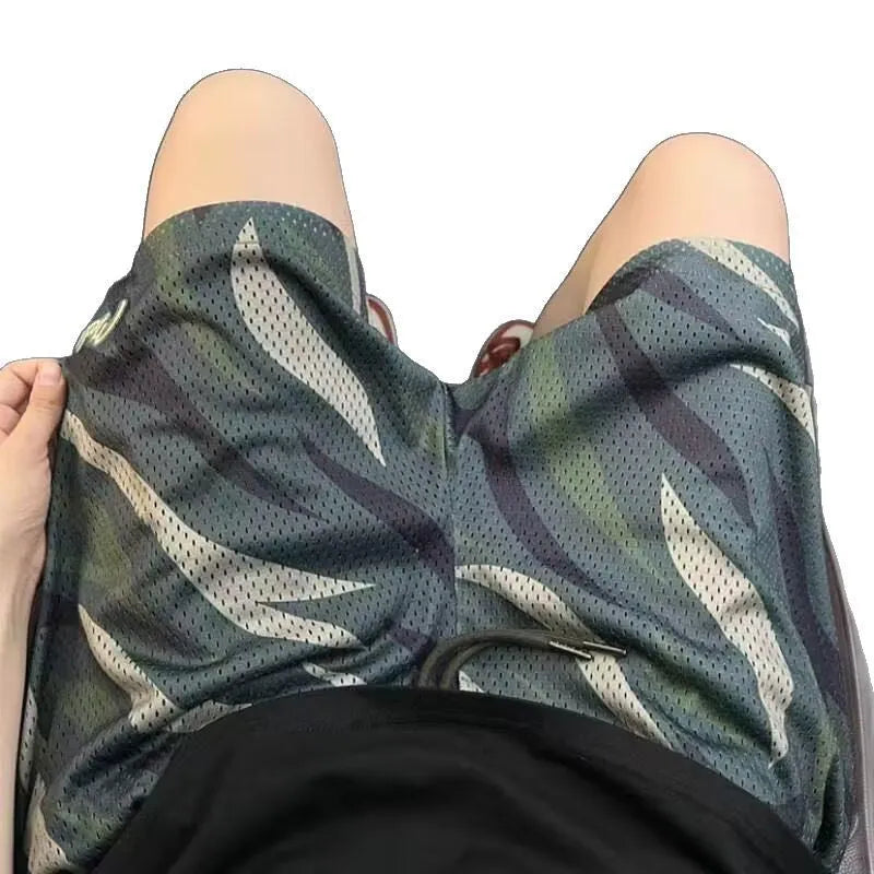 Men's straight-leg camouflage shorts in cotton blend polyester fabric on a mannequin.