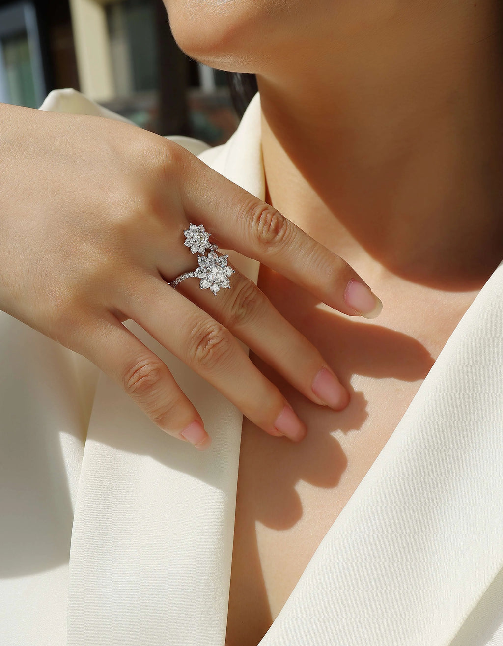 Wedding ring set with 1 carat round moissanite stone in S925 silver with platinum plating on white background