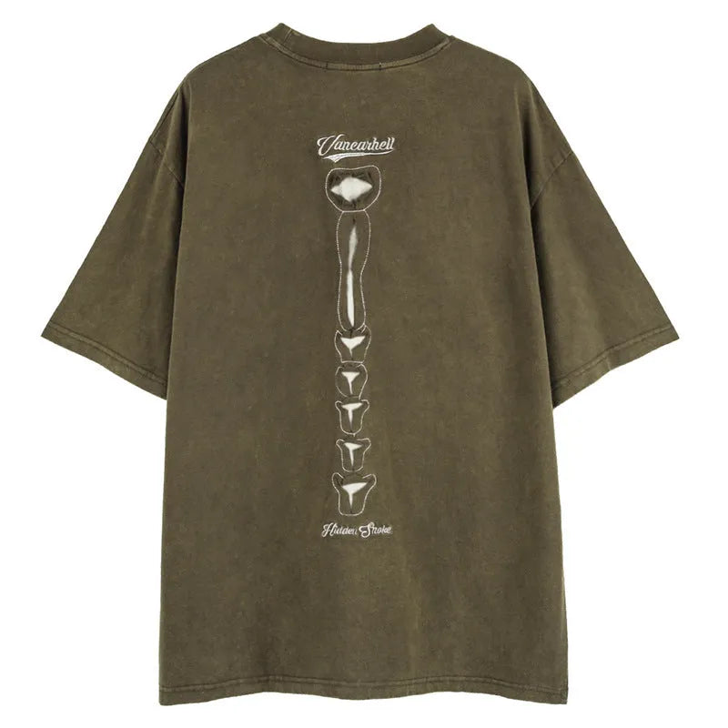 Man modelling a black loose-fit cotton short sleeve top with a skull and letters print.