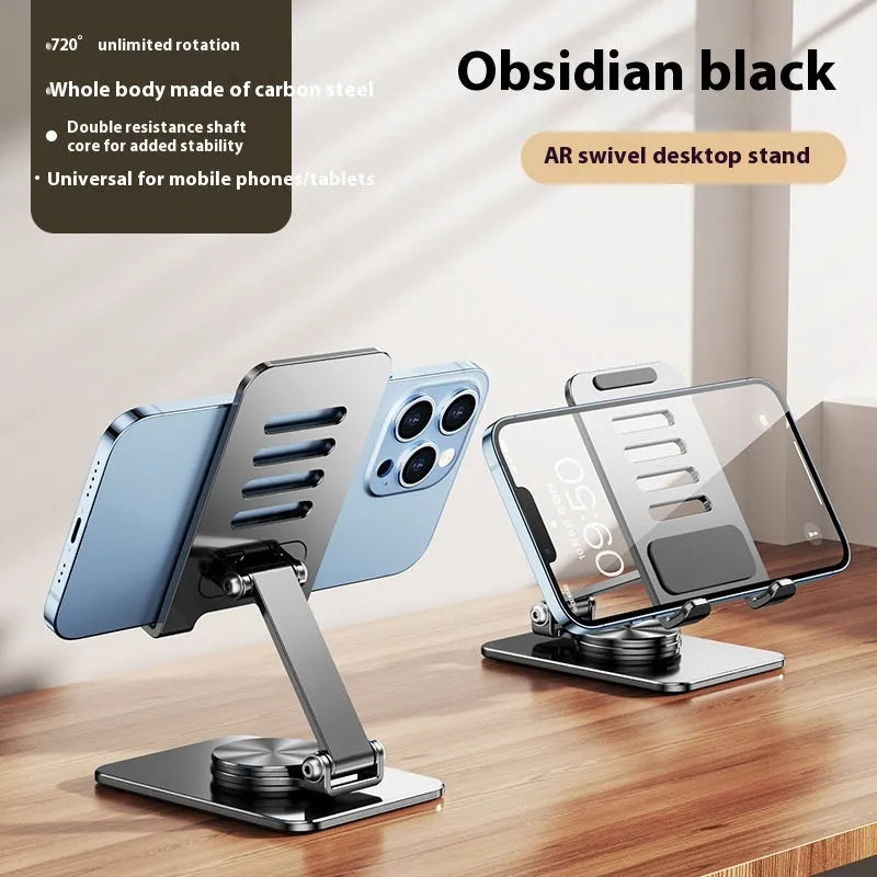 Rotatable folding mobile desktop stand in black on desk holding smartphone