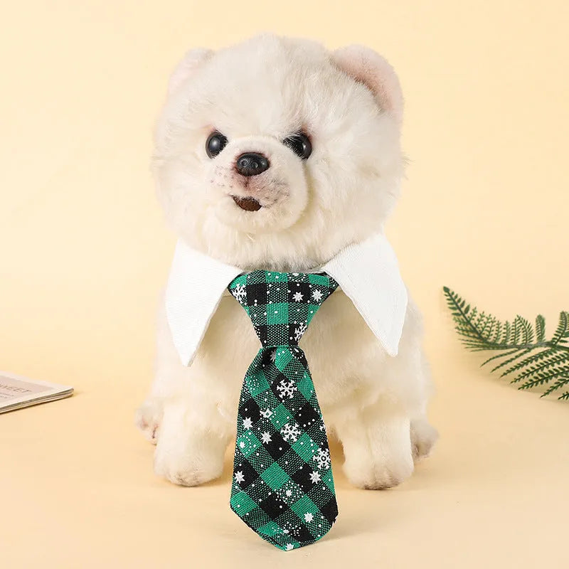 Adjustable Christmas dog necktie in red plaid with snowflake pattern, sized for small medium cats and dogs.