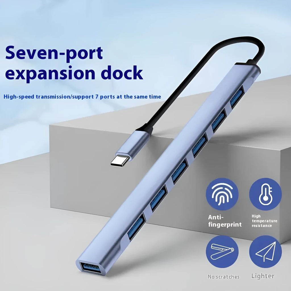 Blue USB-C 7-in-1 docking station with seven USB ports and 0.1m cable on a desk