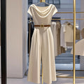 Womens satin jumpsuit in apricot with wide legs quarter sleeves and splicing detail