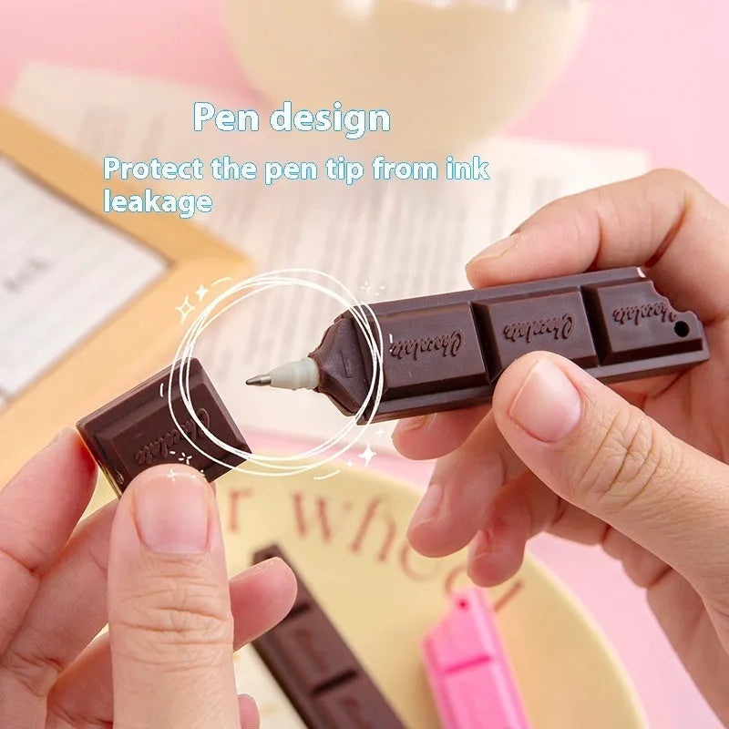 Chocolate bar themed novelty ballpoint pen with 0.5mm tip, shown in pink, beige, and brown refill colour options.
